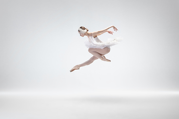 Image showing Young graceful ballerina on white studio background