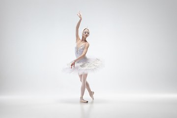 Image showing Young graceful ballerina on white studio background