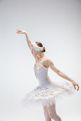 Image showing Young graceful ballerina on white studio background