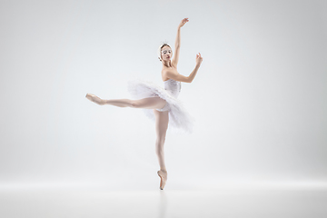 Image showing Young graceful ballerina on white studio background