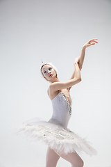 Image showing Young graceful ballerina on white studio background