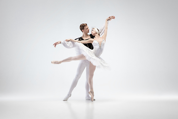 Image showing Young graceful couple of ballet dancers on white studio background