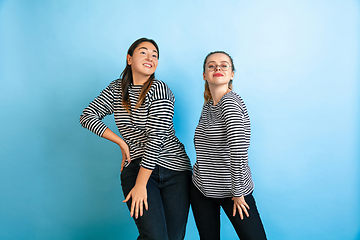 Image showing Young emotional women on gradient blue background