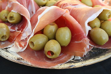 Image showing Serrano ham and olives