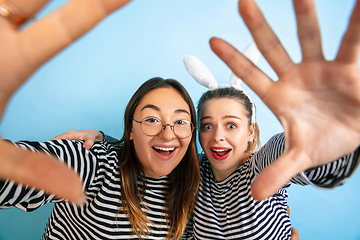 Image showing Young emotional women on gradient blue background