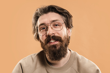 Image showing Half-length portrait of Caucasian man isolated over light yellow background.