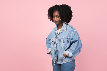 Image showing African-american woman portrait isolated on pink studio background with copyspace