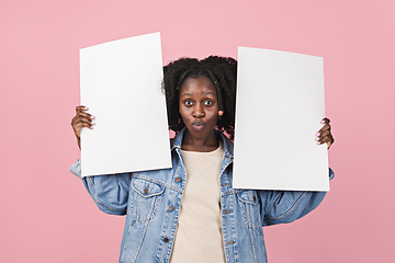 Image showing African-american woman portrait isolated on pink studio background with copyspace