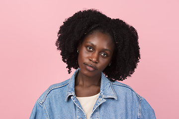 Image showing African-american woman portrait isolated on pink studio background with copyspace