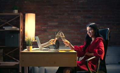 Image showing Young Caucasian woman talking with friend online through laptop.