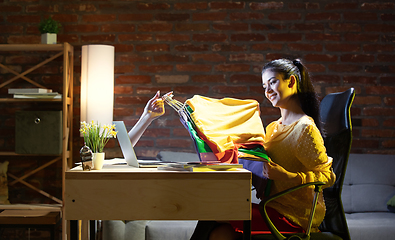 Image showing Young Caucasian woman using shop online through laptop.