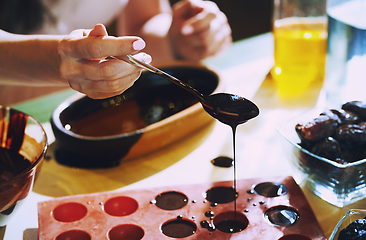 Image showing Staying at home woman preparing handmade vegetarian chocolate tr