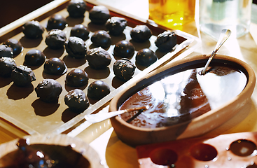 Image showing Homemade organic vegetarian chocolates on a table