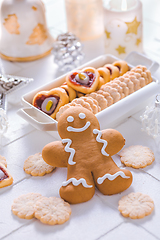 Image showing Homemade Christmas cookies and gingerbread with ornaments in white