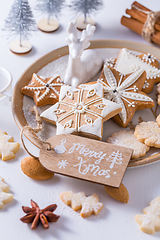 Image showing Homemade Christmas cookies with ornaments in white