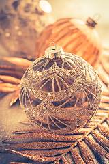 Image showing Christmas ornaments in golden tones