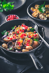 Image showing Baked small eggplants, stuffed with mushrooms and pomegranate