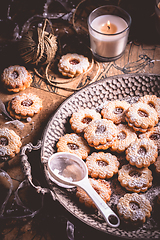 Image showing Homemade Christmas cookies with candles in white vintage style