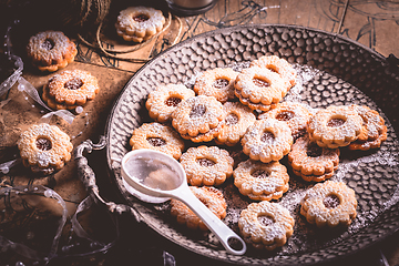 Image showing Homemade Christmas cookies with candles in white vintage style