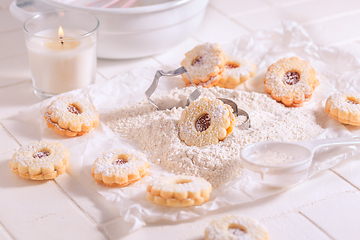 Image showing Homemade Christmas cookies with baking ingredients in white