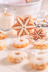 Image showing Homemade Christmas gingerbread and cookies with baking ingredients in white