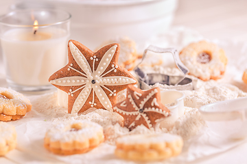 Image showing Homemade Christmas gingerbread and cookies with baking ingredients in white