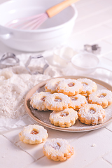 Image showing Homemade Christmas cookies with baking ingredients in white
