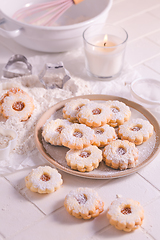 Image showing Homemade Christmas cookies with baking ingredients in white