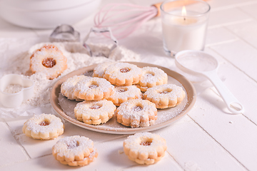 Image showing Homemade Christmas cookies with baking ingredients in white