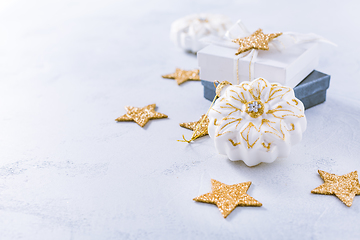 Image showing Christmas ornaments and small present in white