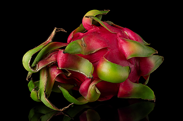 Image showing Dragon fruit horizontally rotated on a black background