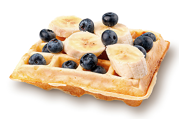 Image showing French waffles with blueberries and bananas isolated on white