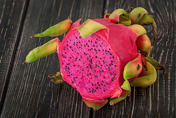 Image showing Half dragon fruit on a wooden planks