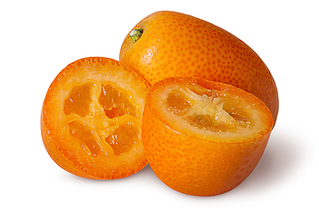 Image showing Halves and whole ripe kumquat isolated on white