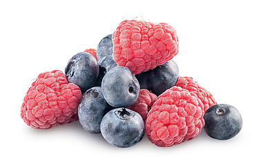 Image showing Heap of raspberries and blueberries isolated on white