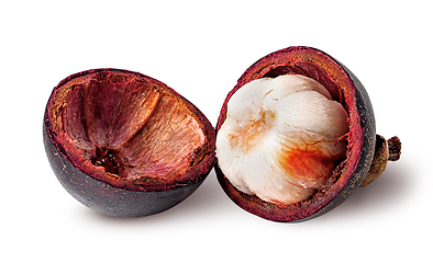 Image showing Opened mangosteen and shells near isolated on white