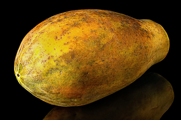 Image showing Papaya whole with reflection isolated on black