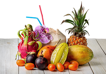 Image showing Tropical fruits on wooden table top view