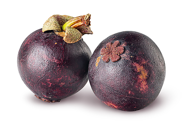 Image showing Two ripe mangosteen isolated on a white