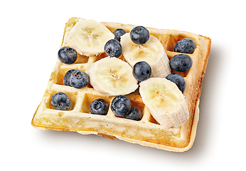 Image showing French waffles with blueberries and bananas top wiev