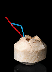 Image showing Young coconut isolated on a black background