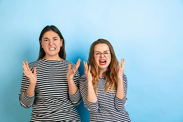 Image showing Young emotional women on gradient blue background