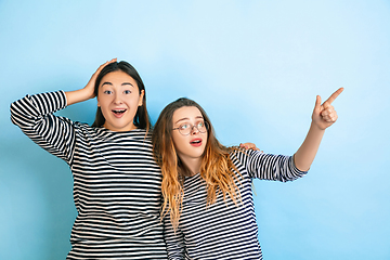 Image showing Young emotional women on gradient blue background