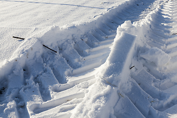 Image showing Traces of the car on the snow