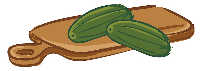 Image showing Couple of cucumbers on a chopping board 