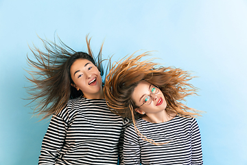 Image showing Young emotional women on gradient blue background