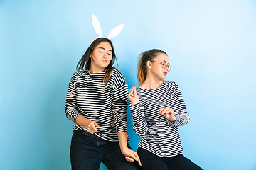 Image showing Young emotional women on gradient blue background