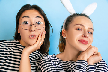 Image showing Young emotional women on gradient blue background