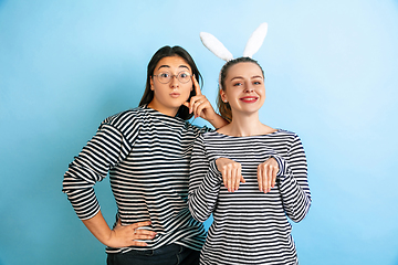 Image showing Young emotional women on gradient blue background