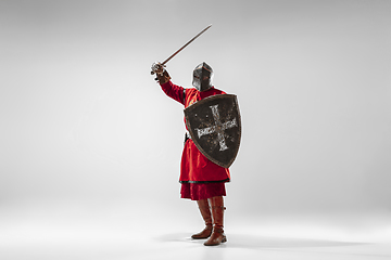 Image showing Brave armored knight fighting isolated on white studio background